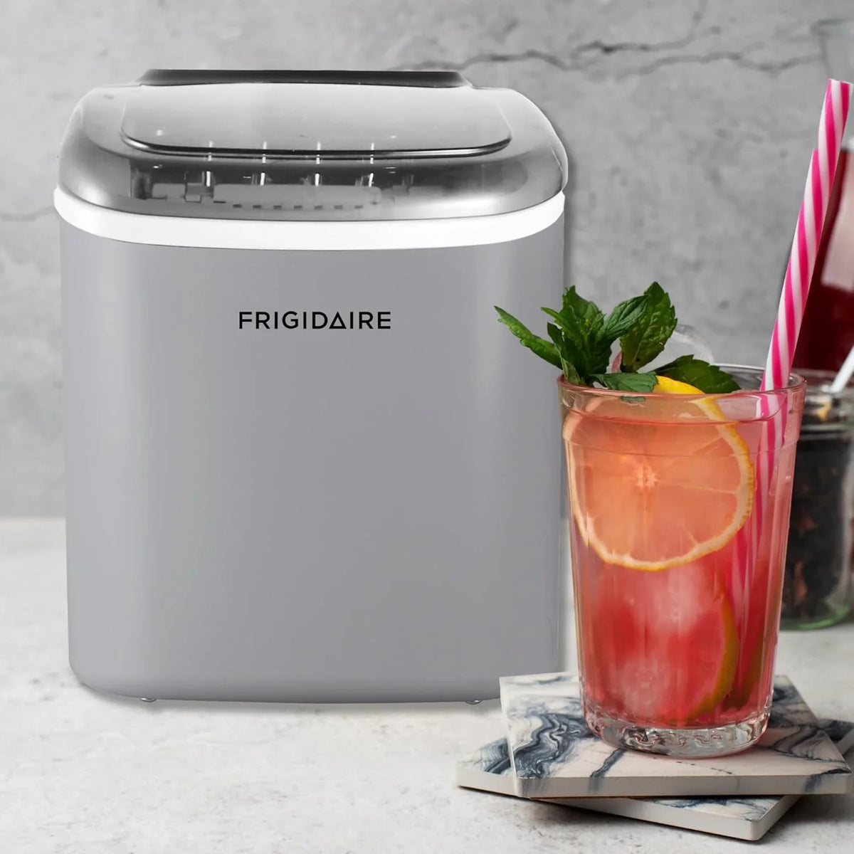 Compact desktop ice machine, capable of producing 26 pounds of ice per day, black color