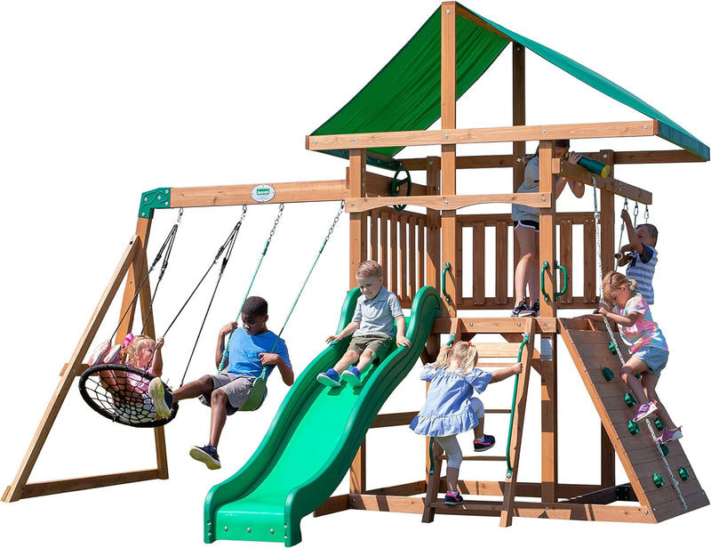 A complete set of wooden mountain-style swings, equipped with a colorful canvas sunshade, a wave slide, a rope swing, a net swing, and a rock wall with climbing ropes and ladders. D3301